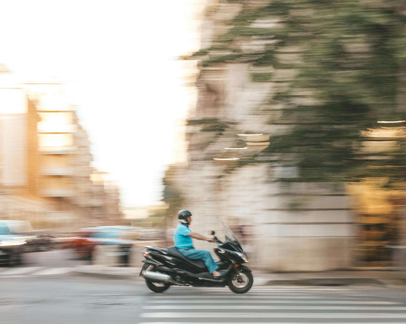 man on a scooter on a street